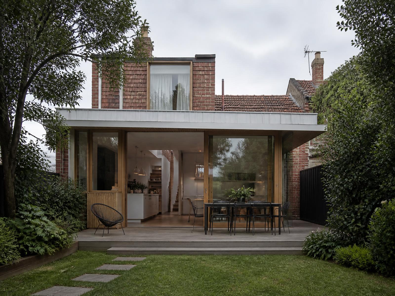 Timber and glass rear extension to a heritage brick cottage